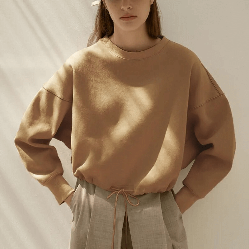 Casual solid women's hoodie with O-neck and drawstring, perfect for cozy comfort. Crafted from breathable 100% cotton for style and durability.